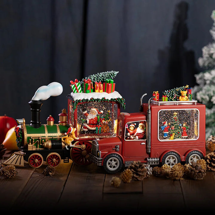 caixa de música de natal locomotiva e caminhão sobre mesa de madeira