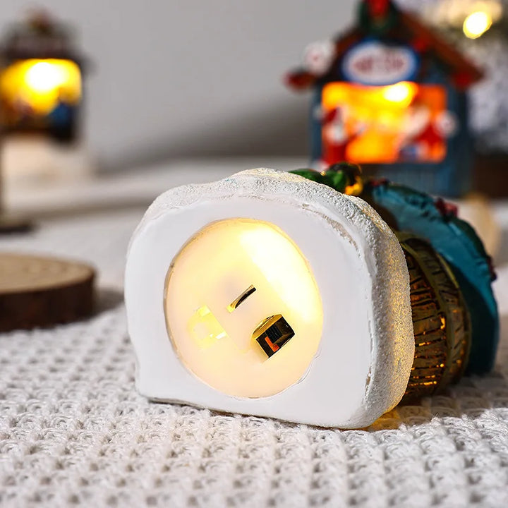 base da casinha de natal com luz interna acesa