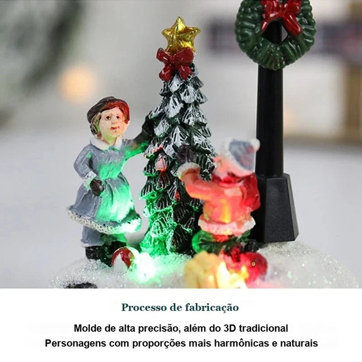 figuras da vila de natal com árvore iluminada em luz colorida