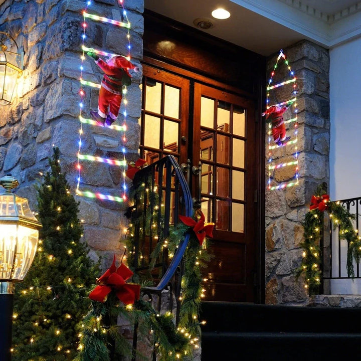 escadas de luz coloridas com papai noel na fachada de pedra