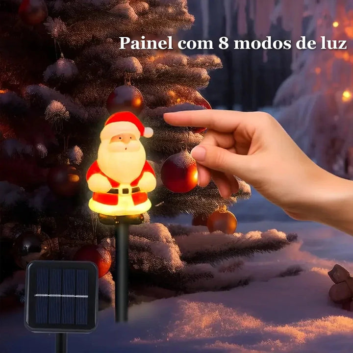 estaca solar de papai noel acesa com painel de 8 modos