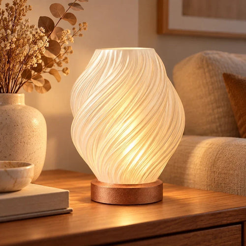 abajur para quarto com cúpula espiralada e base cobre em ambiente decorado