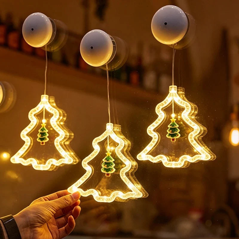 detalhe da árvore de natal luminosa com ventosa e pinheirinho verde