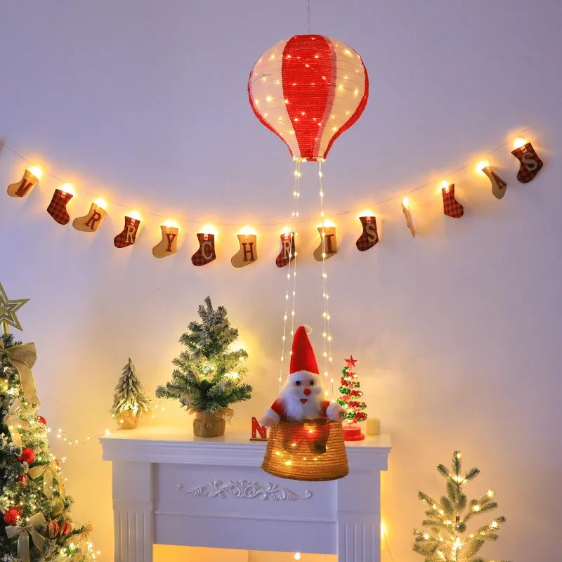 enfeite de natal balao do papai noel iluminado acima da lareira