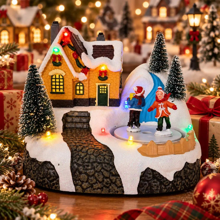 vila de natal musical com casinha nevada e patinadores