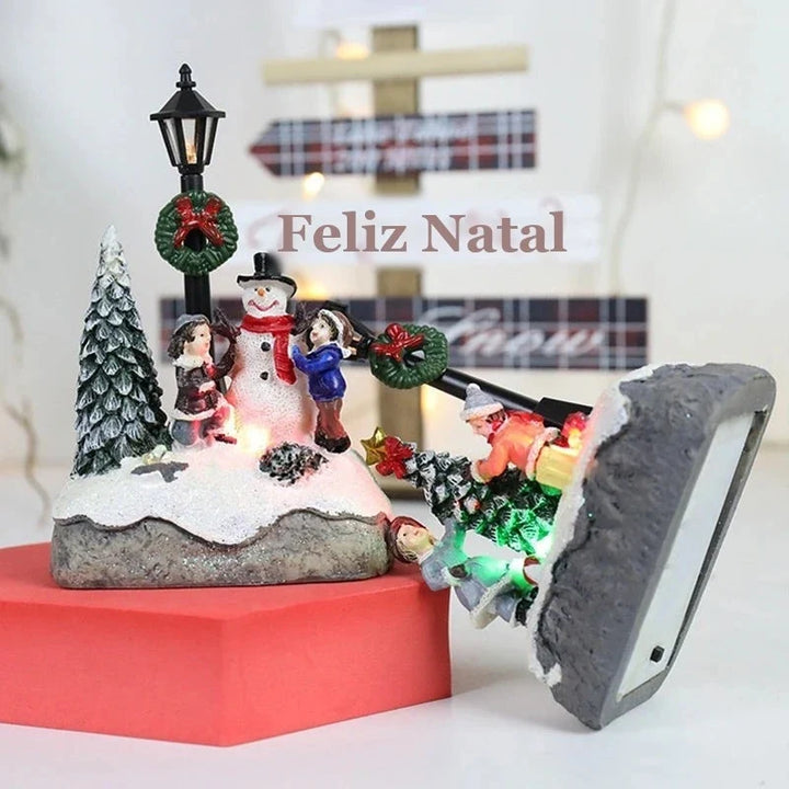 miniatura de natal iluminada com poste e pinheiro nevado