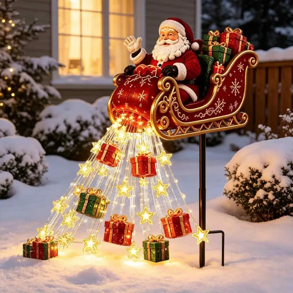 trenó do papai noel iluminado com presentes e estrelas led em frente à casa