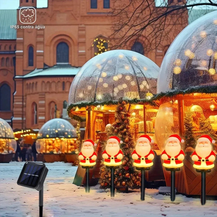 cinco estacas de papai noel iluminadas com painel solar