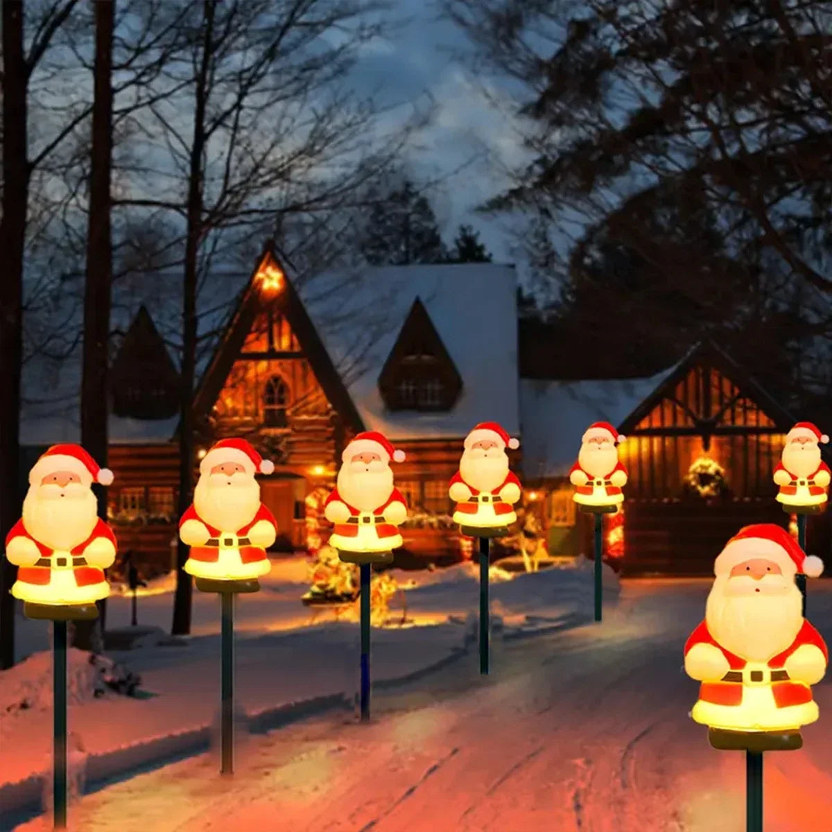 caminho do jardim iluminado por estacas solares de papai noel