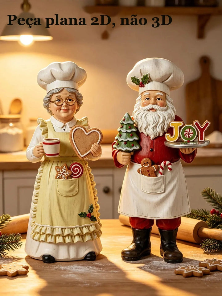 papai noel e mamãe noel confeiteiros com biscoitos de gengibre na cozinha