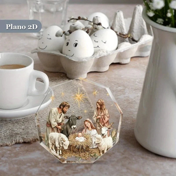 presépio de acrílico decorando mesa ao lado de xícara e vaso