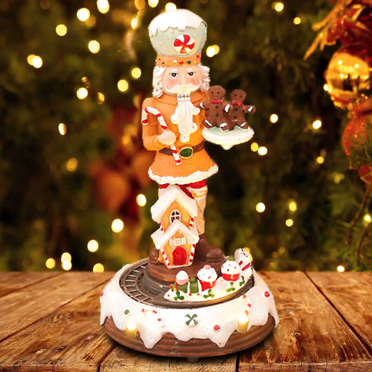 quebra-nozes decorativo com casinha de doce e base iluminada