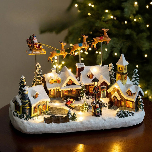 Vila de Natal Iluminada com Música e Movimento Giratório